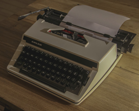 Old Adler typewriter with a blank paper